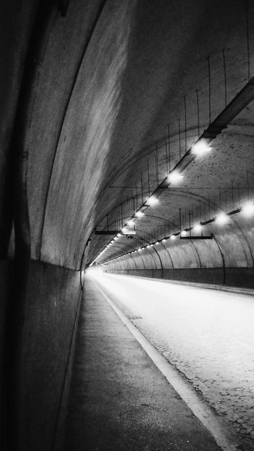 Illuminated curve of an empty tunnel, W:9 H:16, photograph 24