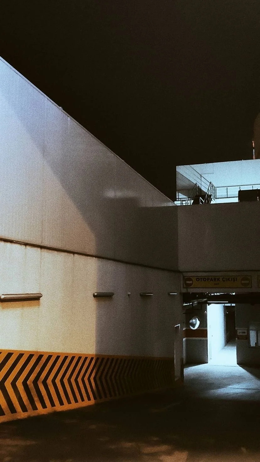 Concrete passage with a bright opening and striped barrier, W:9 H:16, photograph 4