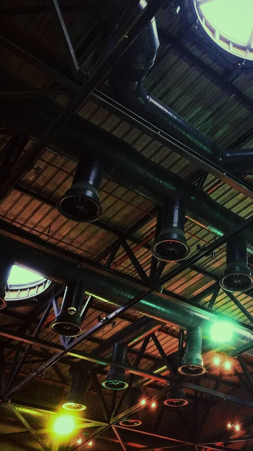 Industrial ceiling with round windows and colorful lights, W:9 H:16, photograph 30