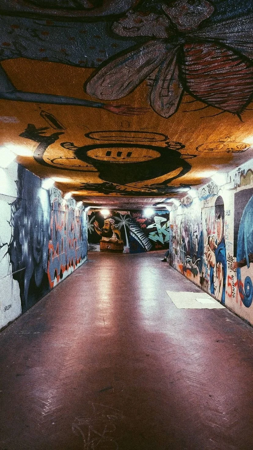 Colorful graffiti along an underground passage, W:9 H:16, photograph 40
