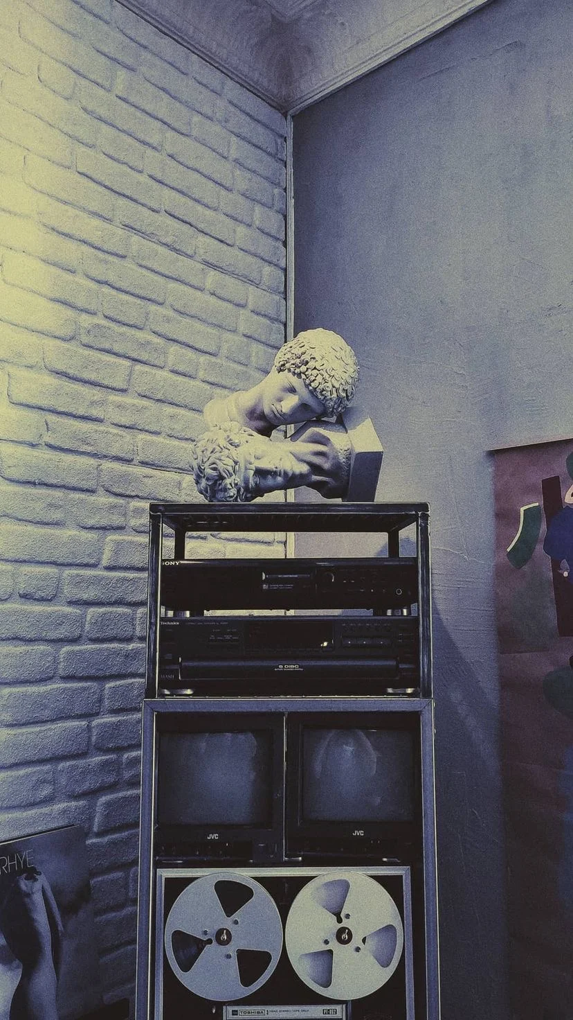 Vintage audio equipment beneath a small decorative object, W:9 H:16, photograph 31