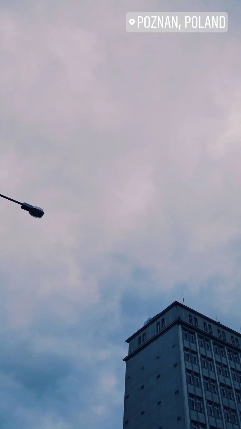 Streetlight and tower block under an overcast sky, W:9 H:16, photograph 15