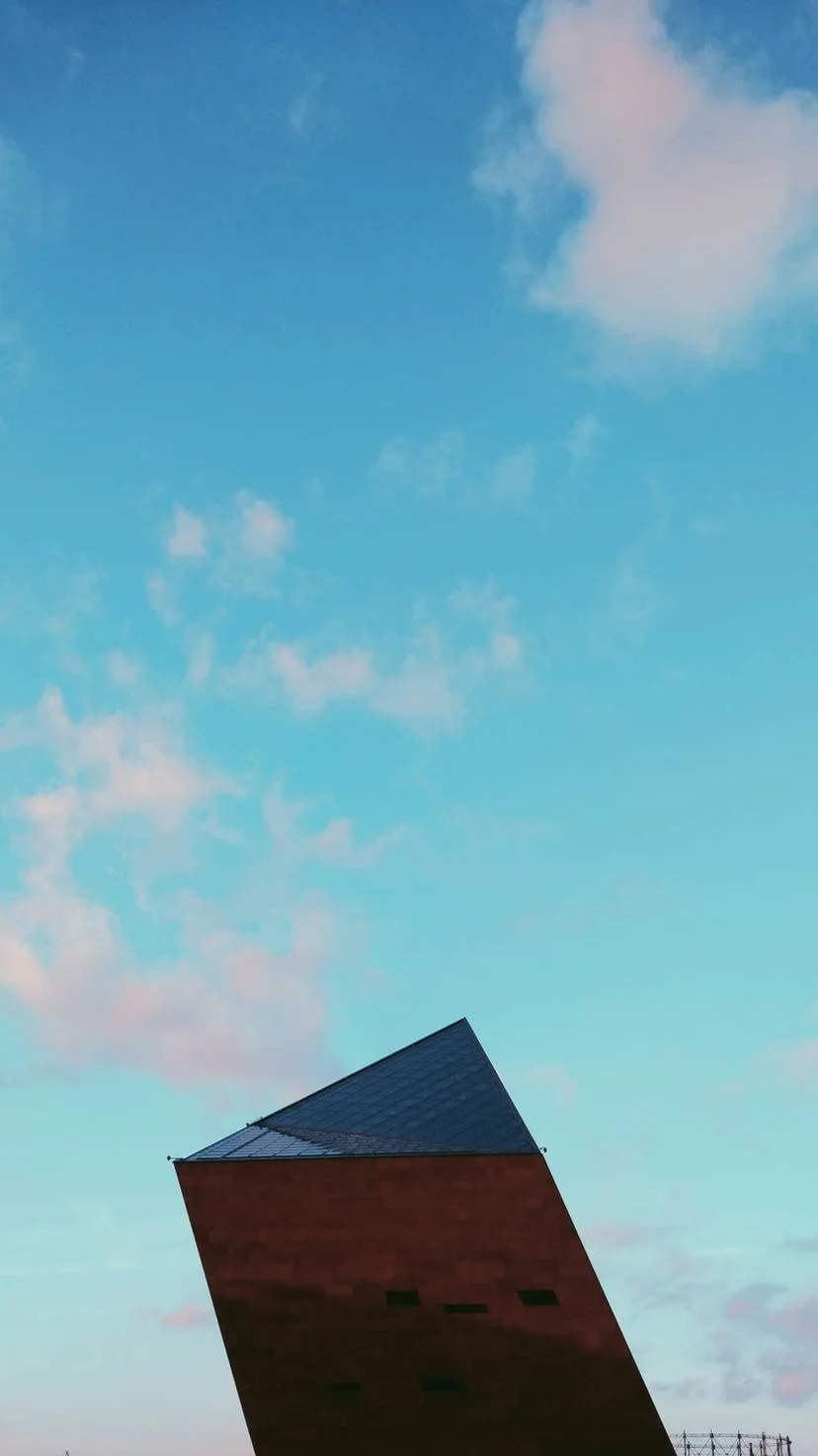 Angular red tower against blue sky, W:9 H:16, photograph 34
