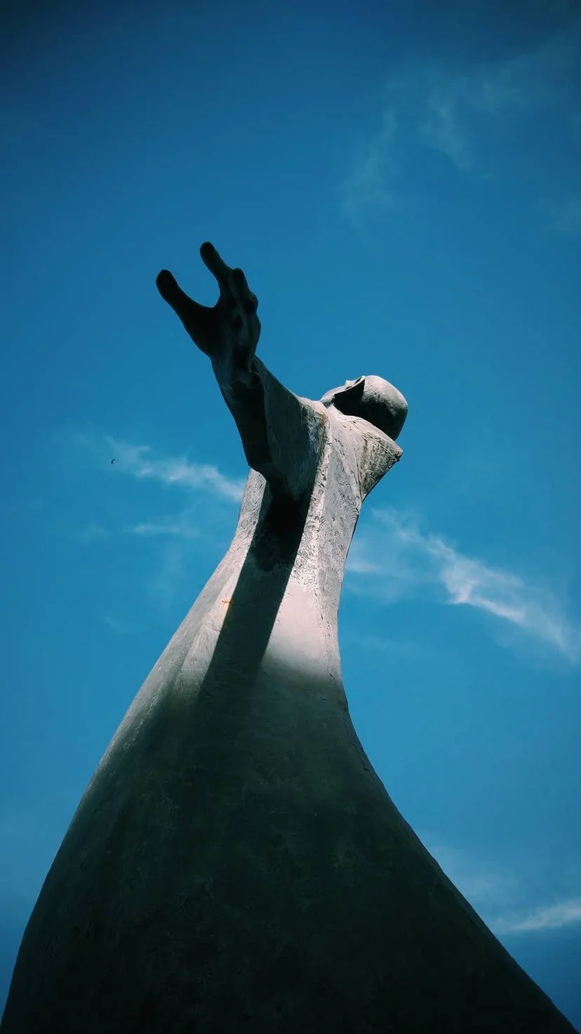 Sculpture rising into a blue sky, W:9 H:16, photograph 52