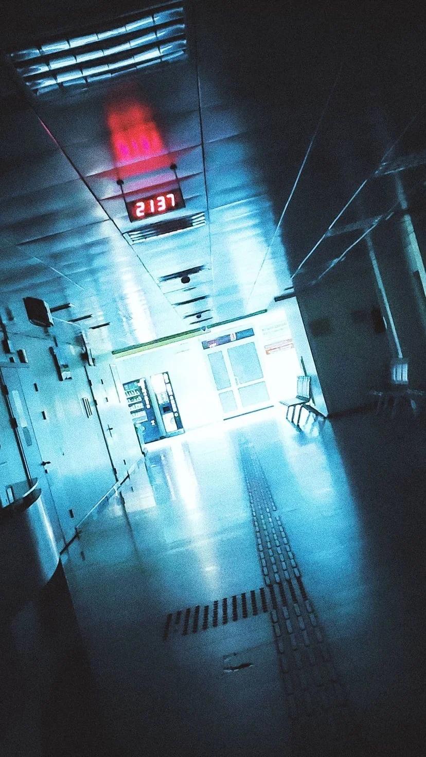 A corridor illuminated by blue and red light, W:9 H:16, photograph 35