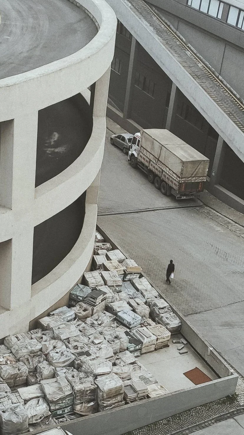 Curved white building overlooking a construction area, W:9 H:16, photograph 50