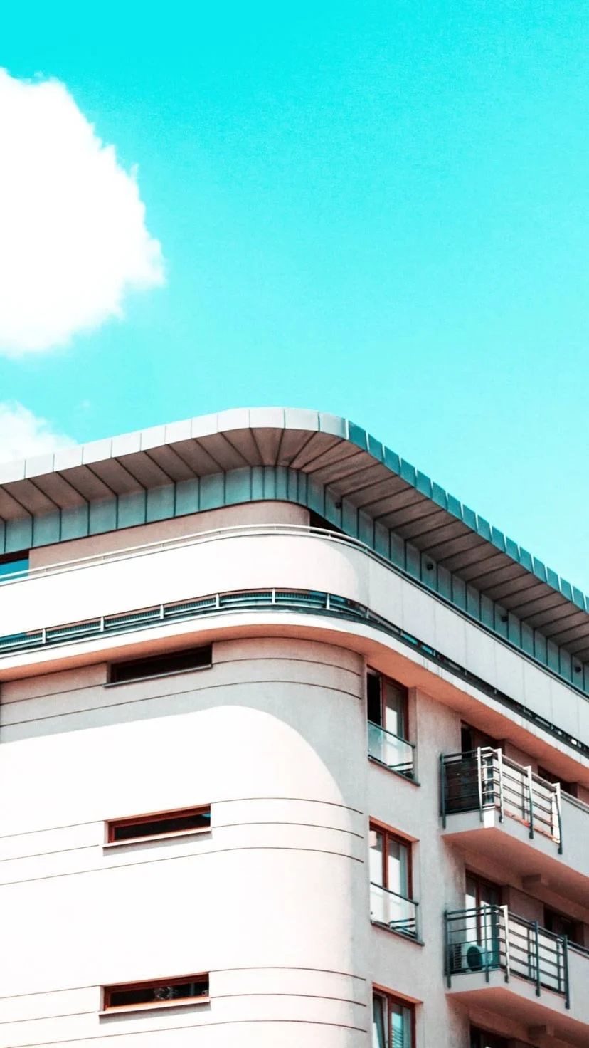 Rounded white building against a bright turquoise sky, W:9 H:16, photograph 20