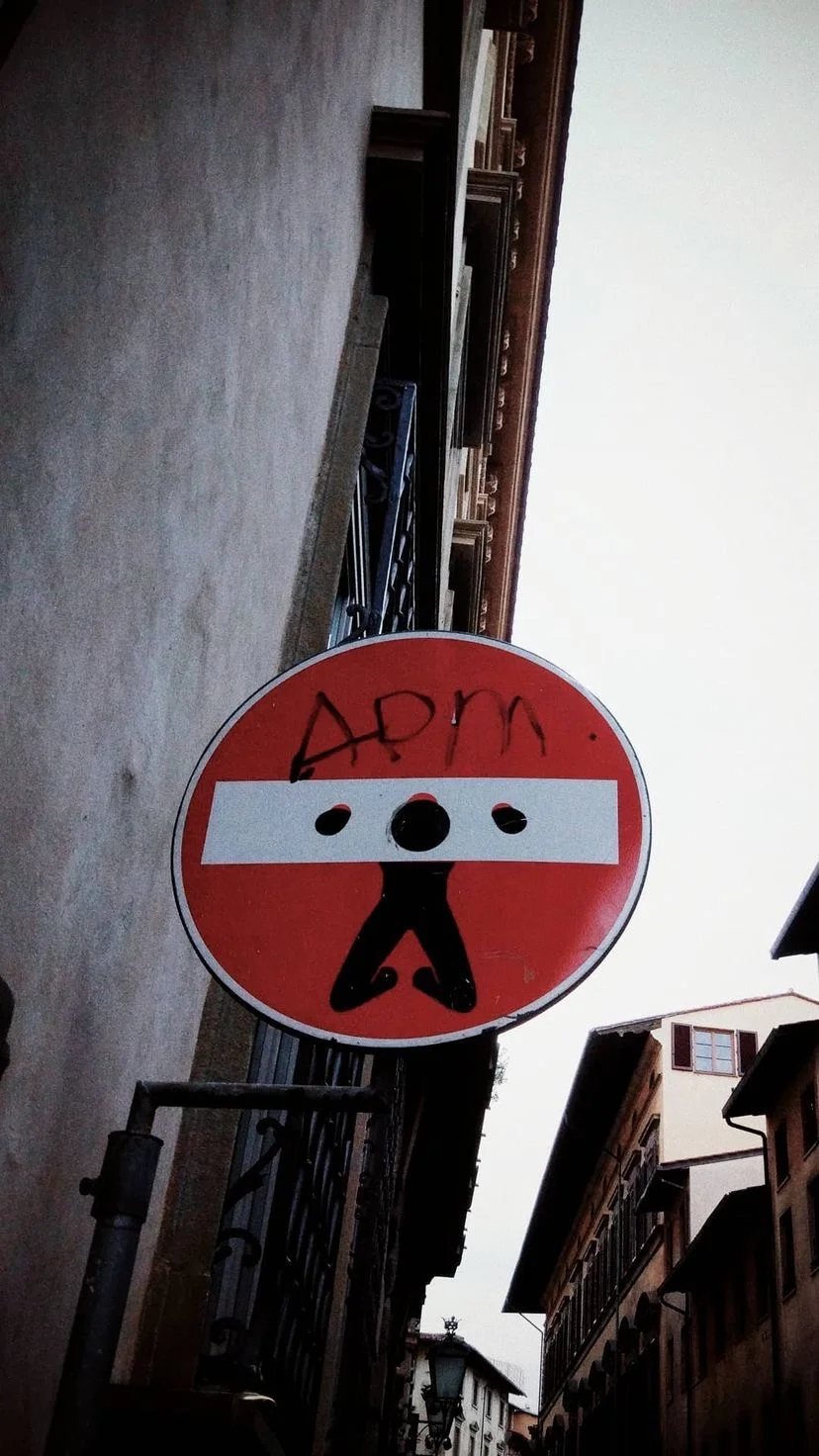Altered red traffic sign on a narrow street, W:9 H:16, photograph 36