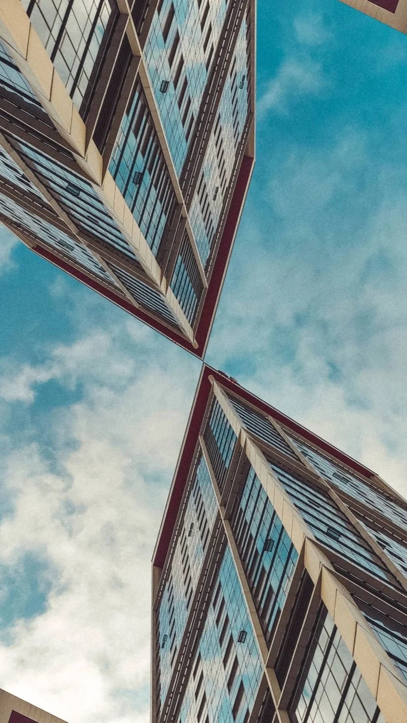 Two building facades converging against the sky, W:9 H:16, photograph 11